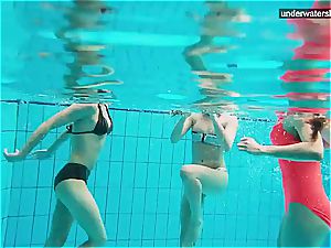 3 nude femmes have fun underwater